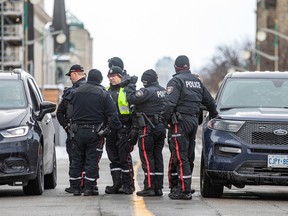 A corps of officers from the Ottawa Police Service, Ottawa By-law Services, the Ontario Provincial Police and the Parliamentary Protective Service kept a watchful eye on Saturday’s protest anniversary.