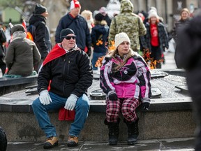 Attendees at Saturday’s event gather near the Centennial Flame on Parliament Hill.