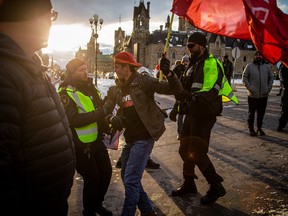 Two people with the Save Canada organization were arrested after an altercation with Parliamentary Protective Service on Parliament Hill Saturday evening.