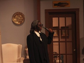 Florence Cole, performs as Justice Lawrence Wargrave, during Holy Trinity High School’s Cappies production of the And Then There Were None, on December 16, 2022, in Ottawa, Ontario.