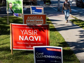 File photo/ Election signs at Dundonald Park within the riding of Ottawa Centre.