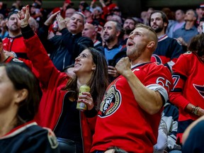 Ottawa Senators fans cheer during NHL action at Canadian Tire Centre