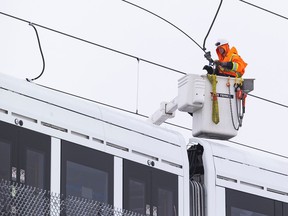 Repairs to the overhead cables on the LRT line between Hurdman and Lees Station on Friday, Jan. 6, 2023 -- . ERROL MCGIHON, Postmedia