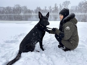 Tareyn Johnson pictured alongside the Rideau River with her dog, Aundeck. Jonhson was out walking her dog early Sunday morning when the dog ran out onto the ice and fell through.