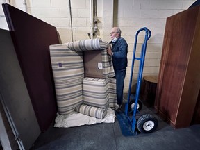 Jim Marr is seen volunteering at the  Matthew House Ottawa Furniture Bank.