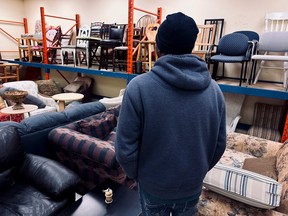 Femi, a refugee from Nigeria, is seen at the Matthew House Ottawa Furniture Bank.