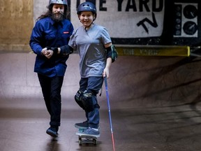 11-year-old Ollie Acosta-Pickering, who is blind after cancer treatment, is relearning how to skateboard with the help of Jordan Wells at The Yard, Jan. 20,2023.