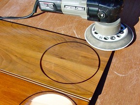 The top piece of flooring is laminate and the lower piece is site-finished real wood. Both were subjected to 60 seconds of abrasive from a random orbit sander to show the differences in abrasion resistance.