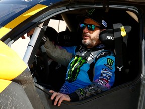 In this file photo taken on January 17, 2020, legendary off-road racer and YouTube star Ken Block prepares to take the wheel of Extreme Es E-SUV to take part in the Grand Prix of Qiddiya finale of the Dakar 2020.