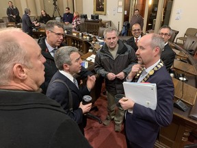 Kingston city councillors chat following Tuesday night's meeting.