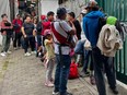 Tourists wait outside the Machu Picchu train station after the railway service was suspended due to damages allegedly caused by protesters in Machu Picchu, Peru, on Jan. 21, 2023. — Peru closed the entrance to the Inca citadel Machu Picchu on Saturday indefinitely, alleging security reasons in the face of protests calling for the resignation of President Dina Boluarte, which already left 46 dead.