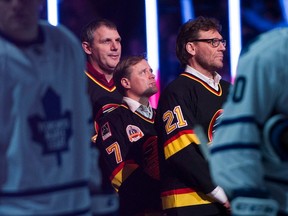 Former Vancouver Canucks Gino Odjick, Cliff Ronning and Jyrki Lumme at Rogers Arena on Feb. 13, 2016.