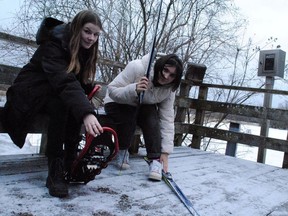 La Citadelle student Emilie Giroux and L'Heritage student Addison Lamontagne show the snowshoeing and cross-country ski equipment available for rent at the Upper Canada Migratory Bird Sanctuary visitor centre on Saturday January 7, 2023 in Ingleside, Ont.