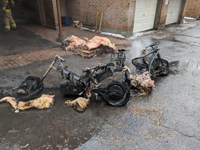 Ottawa firefighters were called to a rowhouse on Cathcart Street, near Cumberland Street, just after 9 a.m. New Year's Day after receiving multiple 911 calls about e-bikes on fire in a carport.