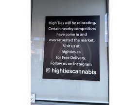 A sign alerting the clientele to the relocation of High Ties on Bank Street.