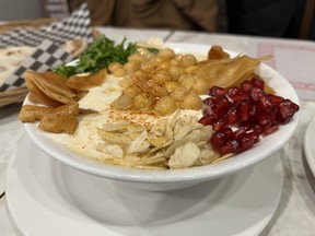Fatteh hummus loaded with almonds, pomegranate seeds, chickpeas and crisp shards of pita bread is one of the breakfast items served at Ottawa Kabab on Gladstone Avenue.