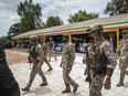 Leader of Mali's ruling junta Lt. Col. Assimi Goita, center, attends an independence day military parade in Bamako, Mali on Sept. 22, 2022. Mali's military junta leader on Friday Jan. 6, 2023 pardoned 49 soldiers from neighboring Ivory Coast who were convicted of undermining Mali's state security and conspiracy against the government.