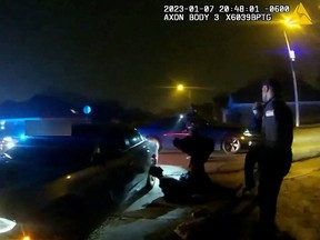 Tyre Nichols, a 29-year-old Black man who was pulled over while driving and died three days later, lays next to a police car after being beaten by Memphis Police Department officers on January 7, 2023, in this still image from video released by Memphis Police Department on Jan. 27, 2023.