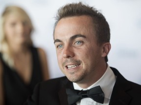 Frankie Muniz, an actor, musician and writer, walks on the red carpet at the River Centre in St. Paul, Minn., Sunday, July 17, 2016. Muniz, best known for his leading role in "Malcolm in the Middle," is planning to compete full time as a race car driver. He will drive the No. 30 Ford for Rette Jones Racing in the ARCA Menards Series