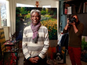 Artist Jaya Krishnan and filmmaker Mike McKay pose for a photo in Jaya's art studio in Ottawa. Mike is making documentary about Jaya's journey back to his homeland to help orphaned street kids.
