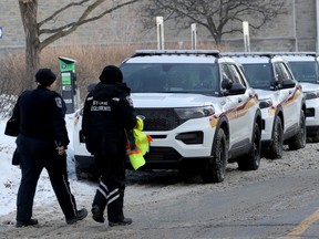 File: Ottawa byLaw officers leaving Ottawa City Hall during the 11th day of the convoy protest occupation Feb. 7, 2022.