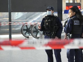 Police officers patrol at the Gare du Nord train station, Wednesday, Jan. 11, 2023 in Paris. A knife attacker wounded six people in an unprovoked attack in Paris' busy Gare du Nord train station Wednesday morning before being shot by police, the French interior minister said.