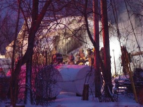 Firefighters work the scene after an explosion at a propane company, on Jan. 12, 2023 in St-Roch-de-L'Achigan.