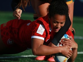 Canada's Fancy Bermudez grabs the ball from an Australian player during the second half of rugby action at the HSBC World Rugby Women's Sevens Series at Starlight Stadium in Langford, B.C., on Saturday, April 30, 2022. Bermudez scored two tries in a losing cause against Brazil at the HSBC Sydney Sevens.