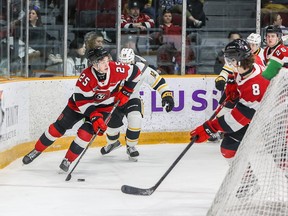 Brad Gardiner (25) of the Ottawa 67's carries the puck behind his net against the Sarnia Sting.