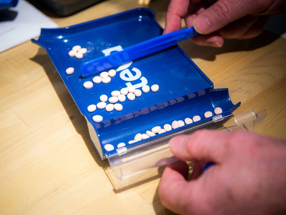  pharmacist scott watson, owner of watson’s pharmacy and compounding centre, prepares a prescription on saturday.