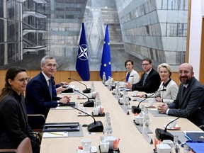 NATO Secretary General Jens Stoltenberg, President of the European Commission Ursula von der Leyen and President of the European Council Charles Michel meet in Brussels on Jan. 10.