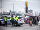 OTTAWA -- Protesters gathered around Parliament Hill and the downtown core for the convoy protest that made their way from various locations across Canada, Sunday January 30, 2022.