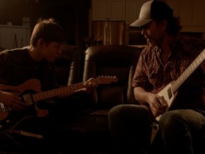 From left, Kaden Noskiye and Corb Lund in Guitar Lessons.