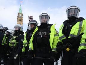 Feb 19, 2022: Police move in on protesters on Wellington Street in front of the Centre Block.