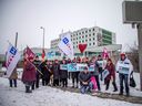 A small group gathered outside The Ottawa Hospital's Riverside campus on Saturday to protest public health care procedures merging with private health care providers.