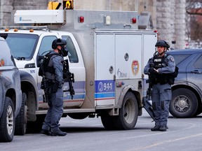The Ottawa Police Service Tactical Unit is shown in action. The national capital region needs a proper security plan, which starts with all levels of government talking to each other, says one reader.