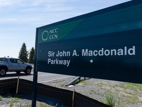 Traffic moves along the Sir John A. Macdonald Parkway in the summer. The NCC plans to rename the road.