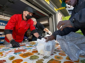 Chef Ric Watson, director of food services from The Ottawa Mission, delivers food and a Thanksgiving meal at the Mission In October, 2022. In total, the mission served 938,218 meals across Ottawa last year.