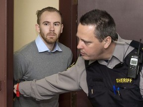 William Sandeson, left, arrives for his preliminary hearing at provincial court in Halifax on Thursday, February 11, 2016.A jury started its third day of deliberations today in the trial of a former Halifax medical student charged with first-degree murder in the 2015 shooting death of a fellow student.