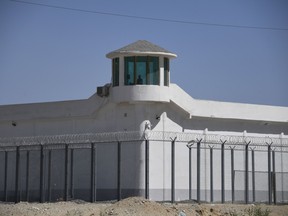 This photo taken on May 31, 2019 shows a watchtower on a high-security facility near what is believed to be a re-education camp in China's northwestern Xinjiang region. As many as one million ethnic Uyghurs and other mostly Muslim minorities are believed to be held in a network of such internment camps in Xinjiang.