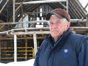 Dave Spence still can't get repairs done to the barn that was severely damaged by the derecho storm last May.