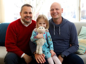 Danny Neville, right, Matt Wilson and their daughter, Lily Wilson, 3, pose with Jeffy. “Everyone was super-helpful online and in real life,” Neville said of the search for the woolly lamb.