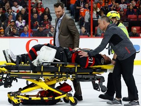 Ottawa Senators goaltender Anton Forsberg (31) is stretchered off the ice by medical personnel after being injured during third period NHL action against the Edmonton Oilers at the Canadian Tire Centre on Saturday, Feb. 11, 2023.