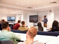 University students study in a classroom with male lecturer