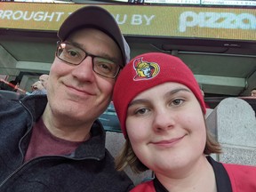 Aaron Robinson and his daughter Bea at a Sens game.  SUPPLIED PHOTOS
