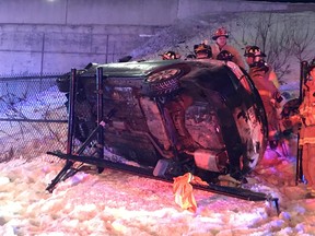Firefighters responding after someone drove off highway 417 overpass and landed on Carling Ave.