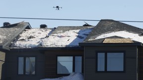 Sebuah drone dipiloti oleh penyelidik di tempat kejadian Selasa pagi.