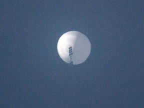 This handout photo from Chase Doak taken on Feb. 1, 2023 shows the Chinese balloon in the sky over Billings, Montana.