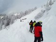 A photo taken on Feb. 4, 2023 shows rescuers during their mission on a slope near Pill, western Austria. — Avalanches in Austria and Switzerland have left five people dead, leading officials to warn on Feb. 4 of the risks posed by particularly unstable snow cover. Three of those killed were visiting Austria's Alpine regions.