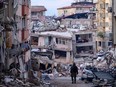 A Turkish soldier walks among destroyed buildings in Hatay, on Feb. 12.